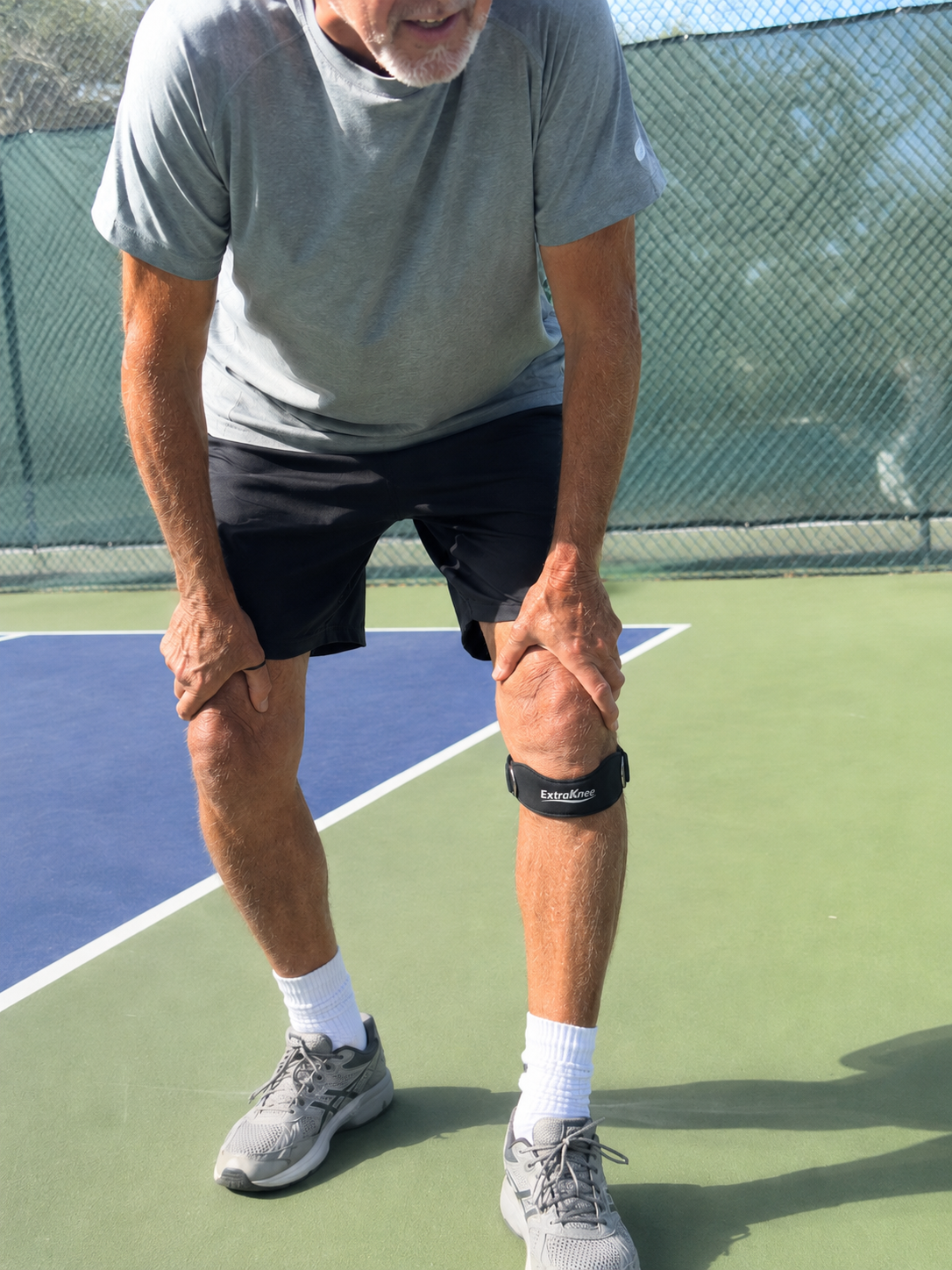 Black ExtraKnee strap on a pickleball court