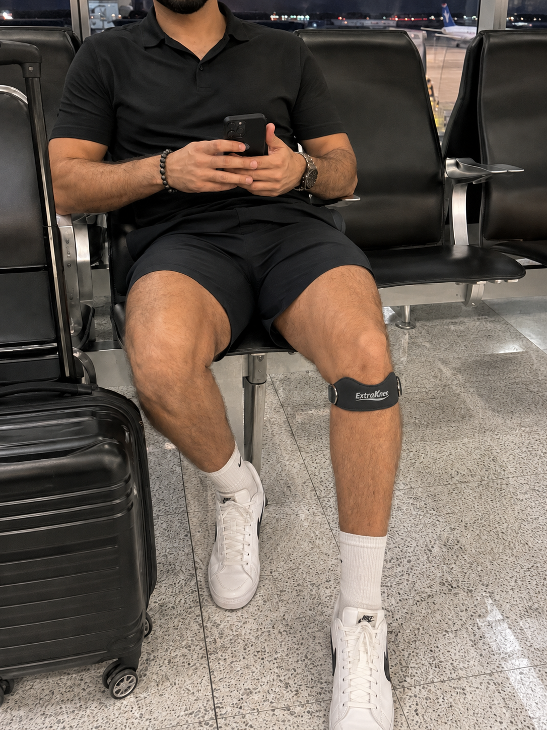 Black ExtraKnee strap worn during travel